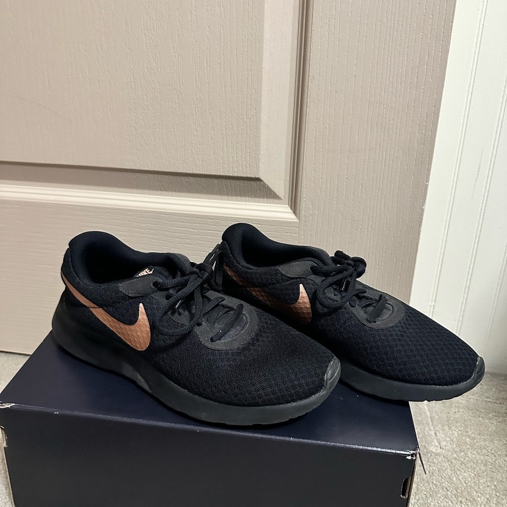 Nike Black Shoes with Bronze Swoosh